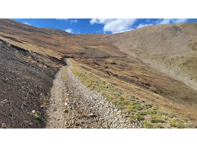 a black and white photo of a road