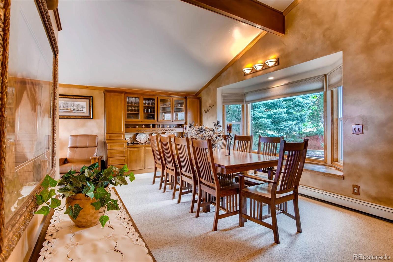 881 Valley Road Littleton, CO 80124 - Photo 15 of 27 a view of a dining room with furniture window and outside view