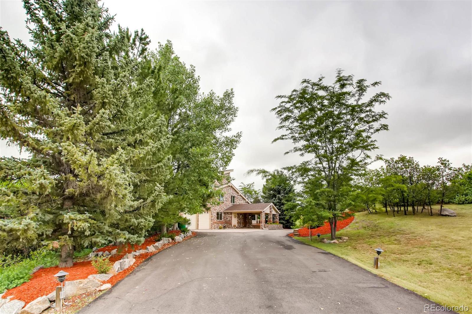 881 Valley Road Littleton, CO 80124 - Photo 24 of 27 view of a house with roof and a yard
