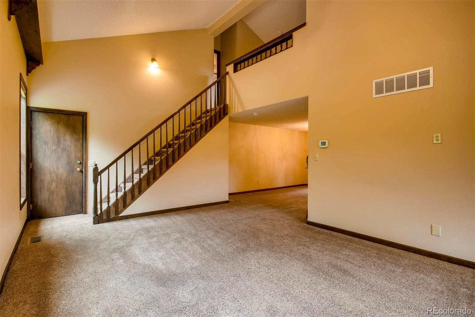 881 Valley Road Littleton, CO 80124 - Photo 25 of 27 a view of a hallway with staircase
