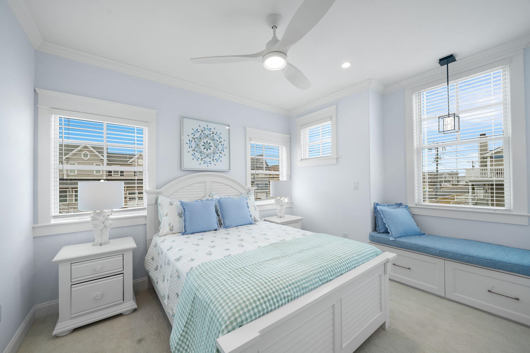 9102 3rd Stone Harbor, NJ 08247 - Photo 23 of 24 a bedroom with a large bed and a window