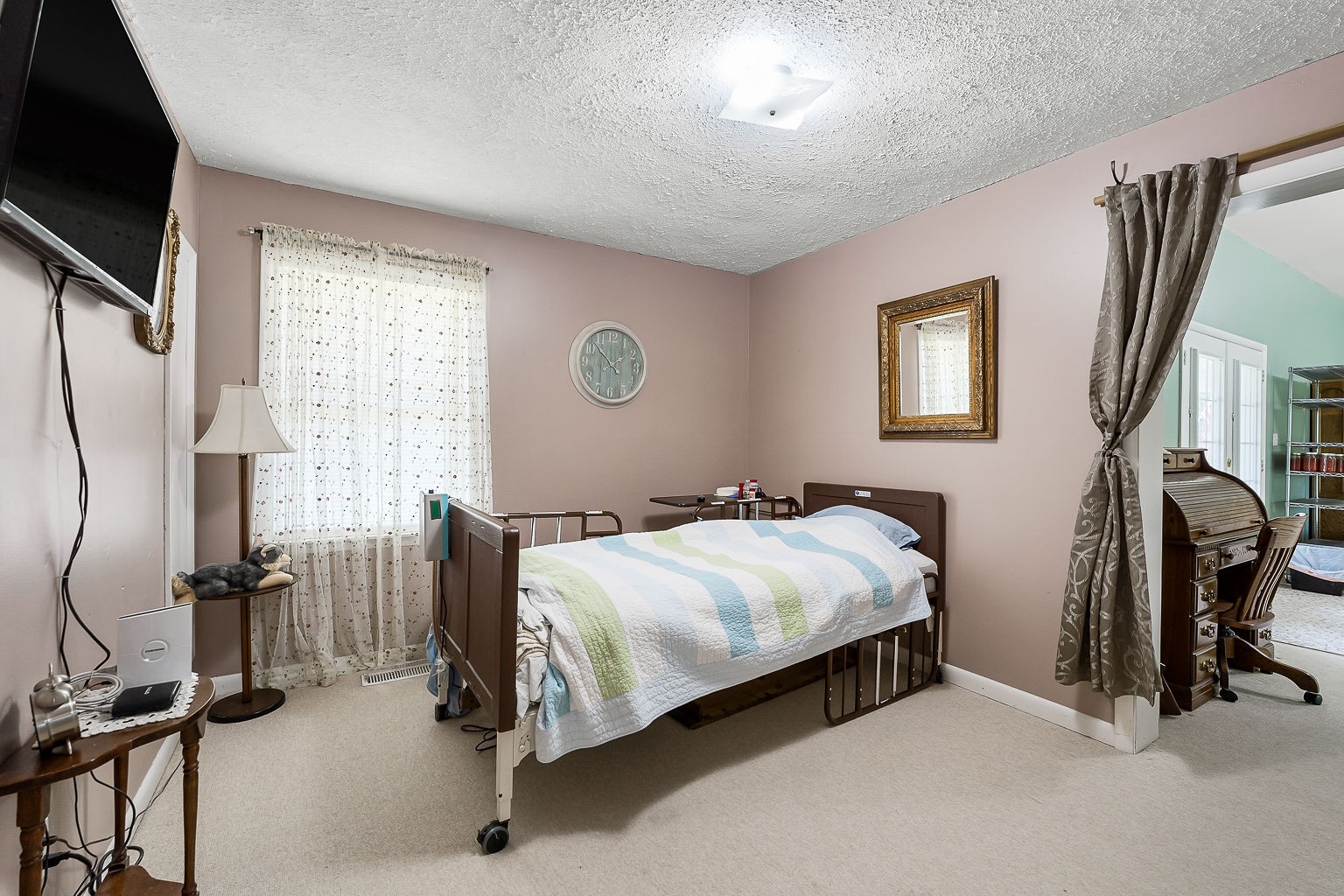 1514 Jefferson Road Smithville, TN 37166 - Photo 17 of 53 a bedroom with a bed a flat screen tv and windows