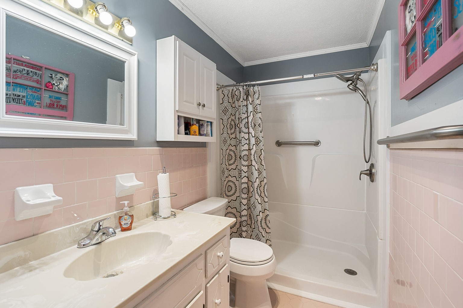 1514 Jefferson Road Smithville, TN 37166 - Photo 18 of 53 a bathroom with a sink toilet and shower