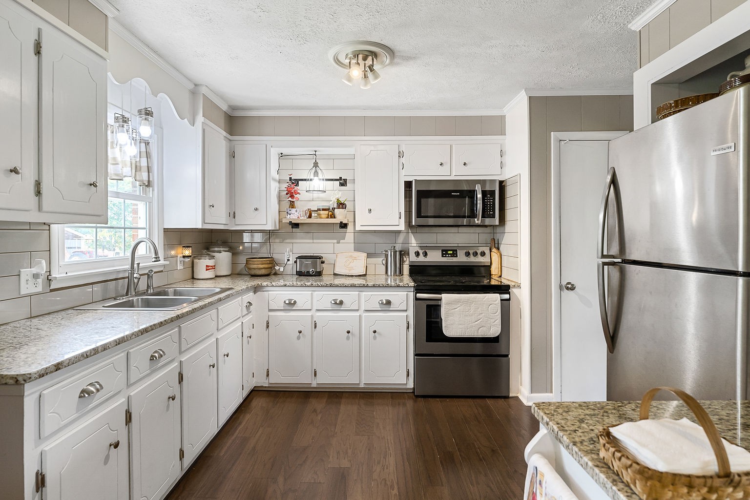 1514 Jefferson Road Smithville, TN 37166 - Photo 23 of 53 a kitchen with stainless steel appliances granite countertop a refrigerator sink and stove