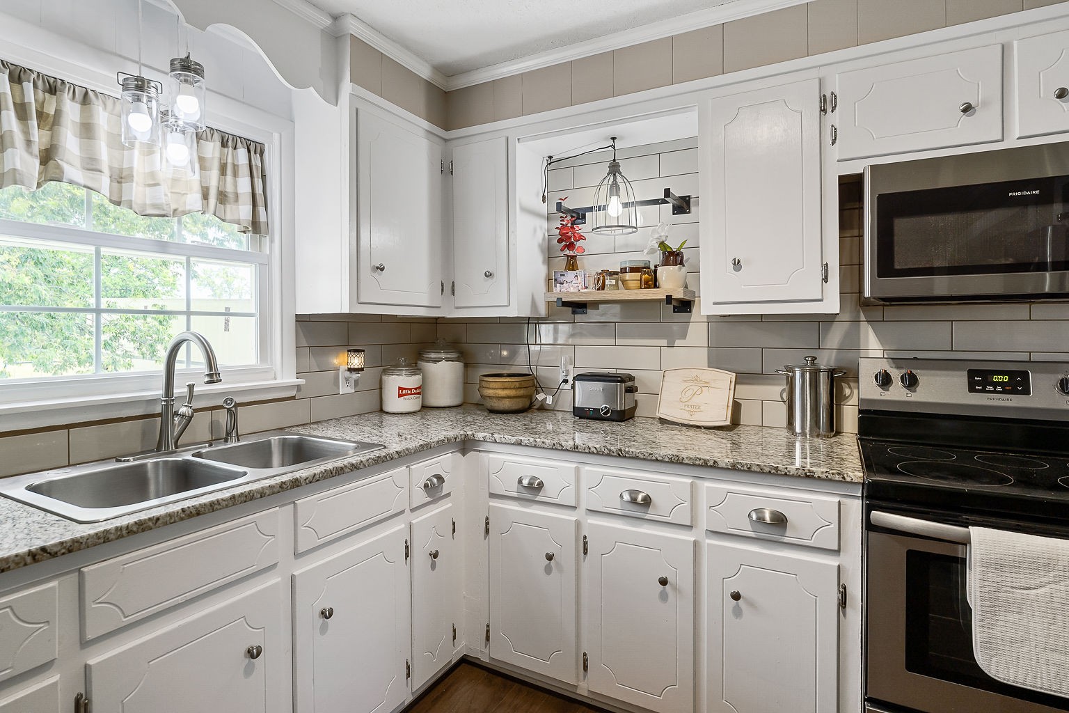 1514 Jefferson Road Smithville, TN 37166 - Photo 24 of 53 a kitchen with white cabinets and white appliances