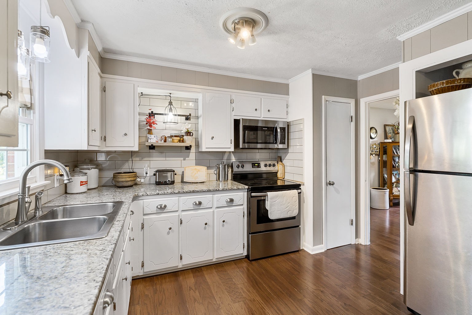 1514 Jefferson Road Smithville, TN 37166 - Photo 25 of 53 a kitchen with stainless steel appliances granite countertop a refrigerator sink and stove