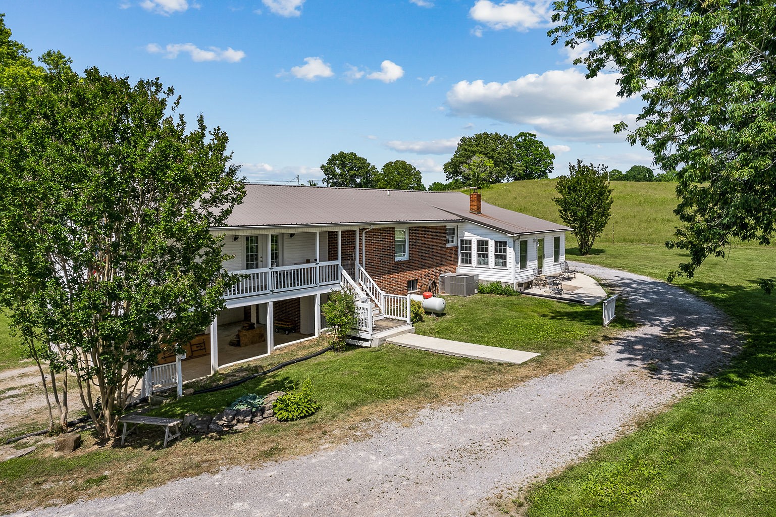 1514 Jefferson Road Smithville, TN 37166 - Photo 4 of 53 a front view of a house with a yard and garage