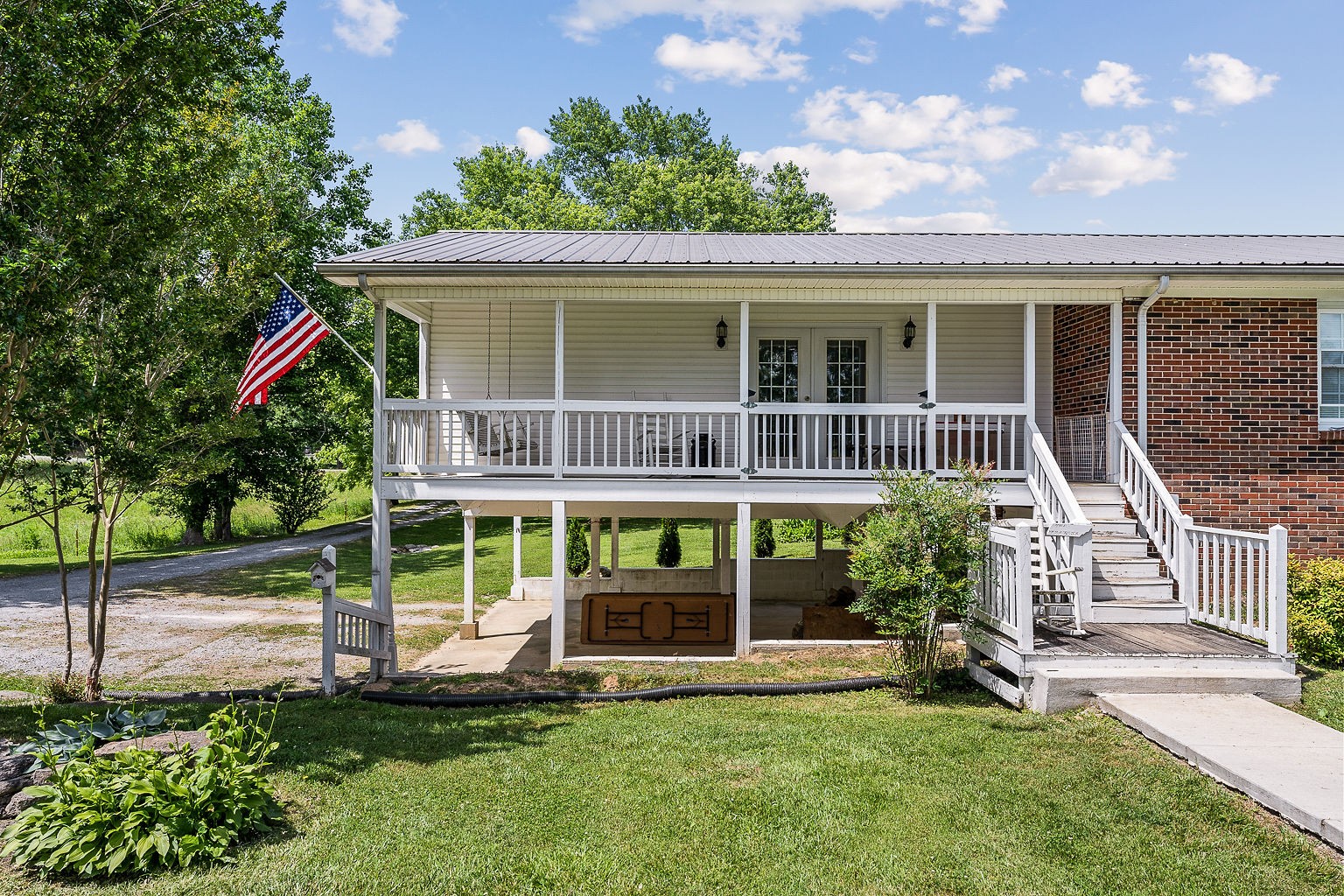 1514 Jefferson Road Smithville, TN 37166 - Photo 44 of 53 a front view of a house with a yard table and chairs