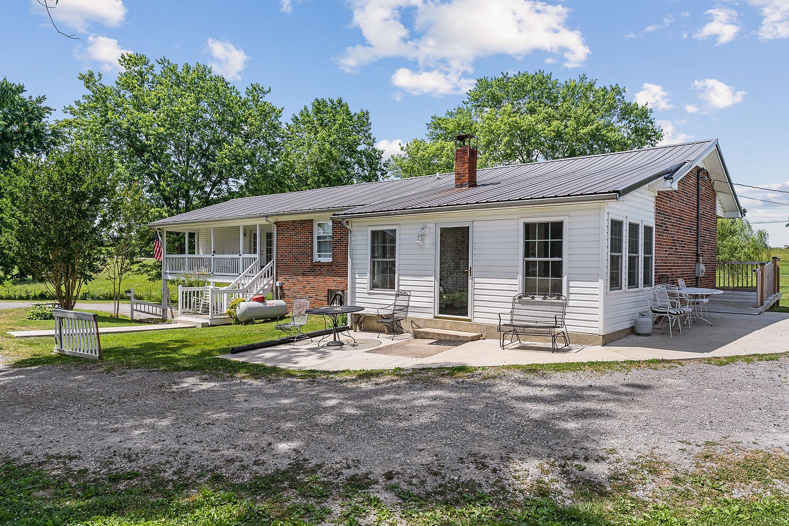 1514 Jefferson Road Smithville, TN 37166 - Photo 47 of 53 a view of a house with backyard sitting area and garden