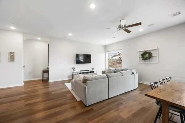 a kitchen with stainless steel appliances sink stove and cabinets