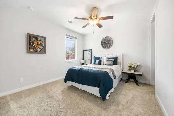 a bedroom with a bed and window