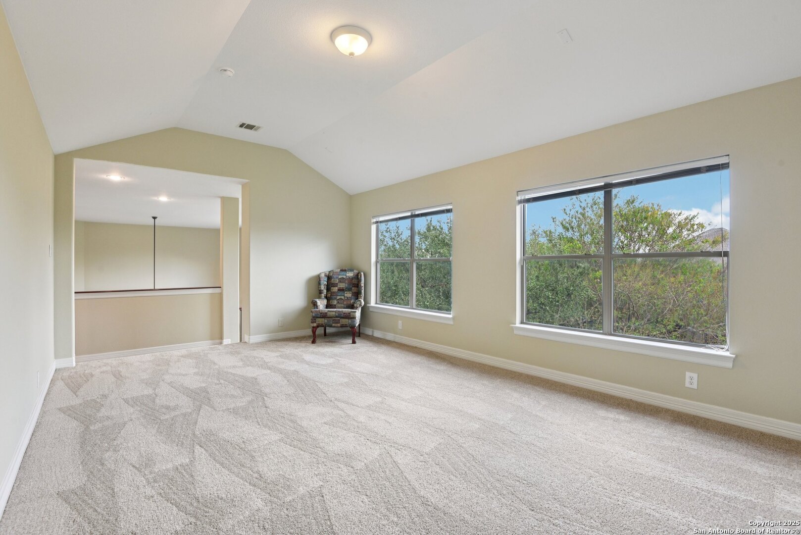 522 Heather Ridge San Antonio, TX 78260 - Photo 24 of 41 an empty room with windows and view of lake