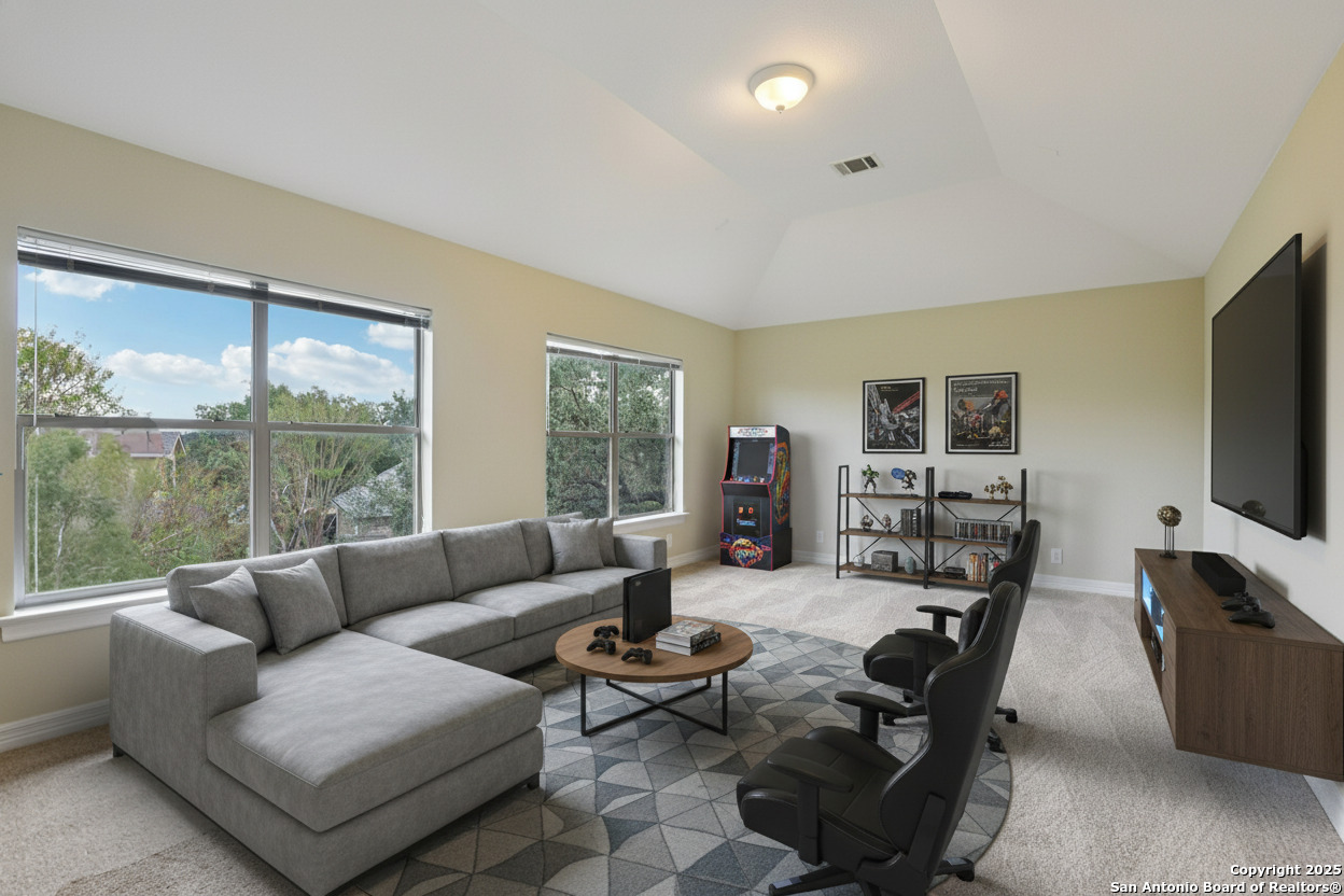 522 Heather Ridge San Antonio, TX 78260 - Photo 25 of 41 a living room with furniture flat screen tv and a large window