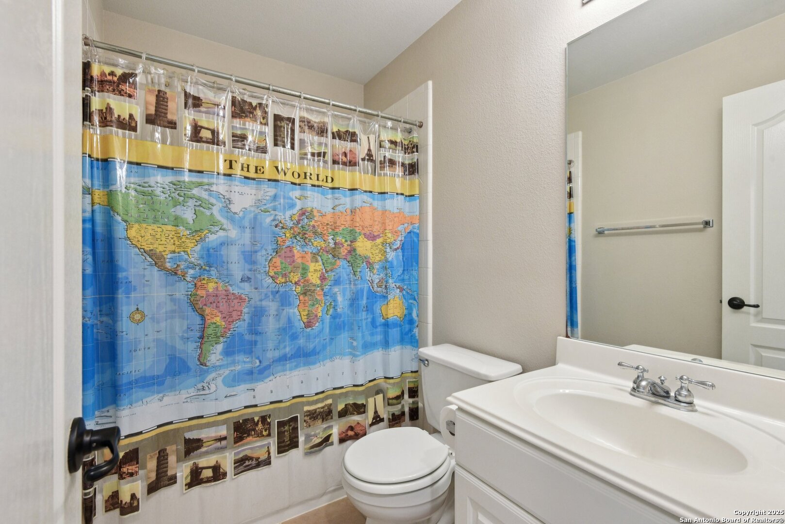 522 Heather Ridge San Antonio, TX 78260 - Photo 27 of 41 a bathroom with a sink a toilet and shower curtain