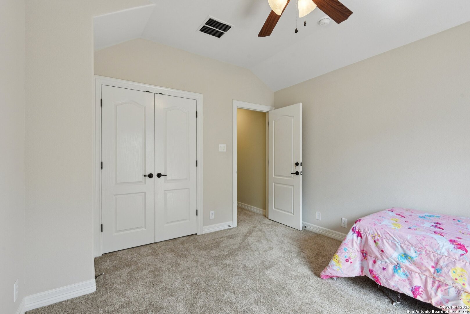 522 Heather Ridge San Antonio, TX 78260 - Photo 28 of 41 a bedroom with a bed and a chandelier fan