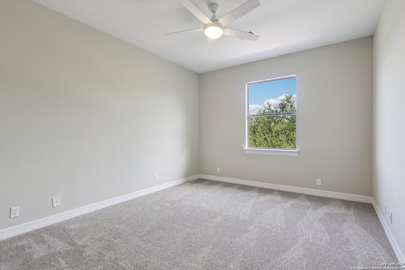 522 Heather Ridge San Antonio, TX 78260 - Photo 32 of 41 an empty room with a window and a fan