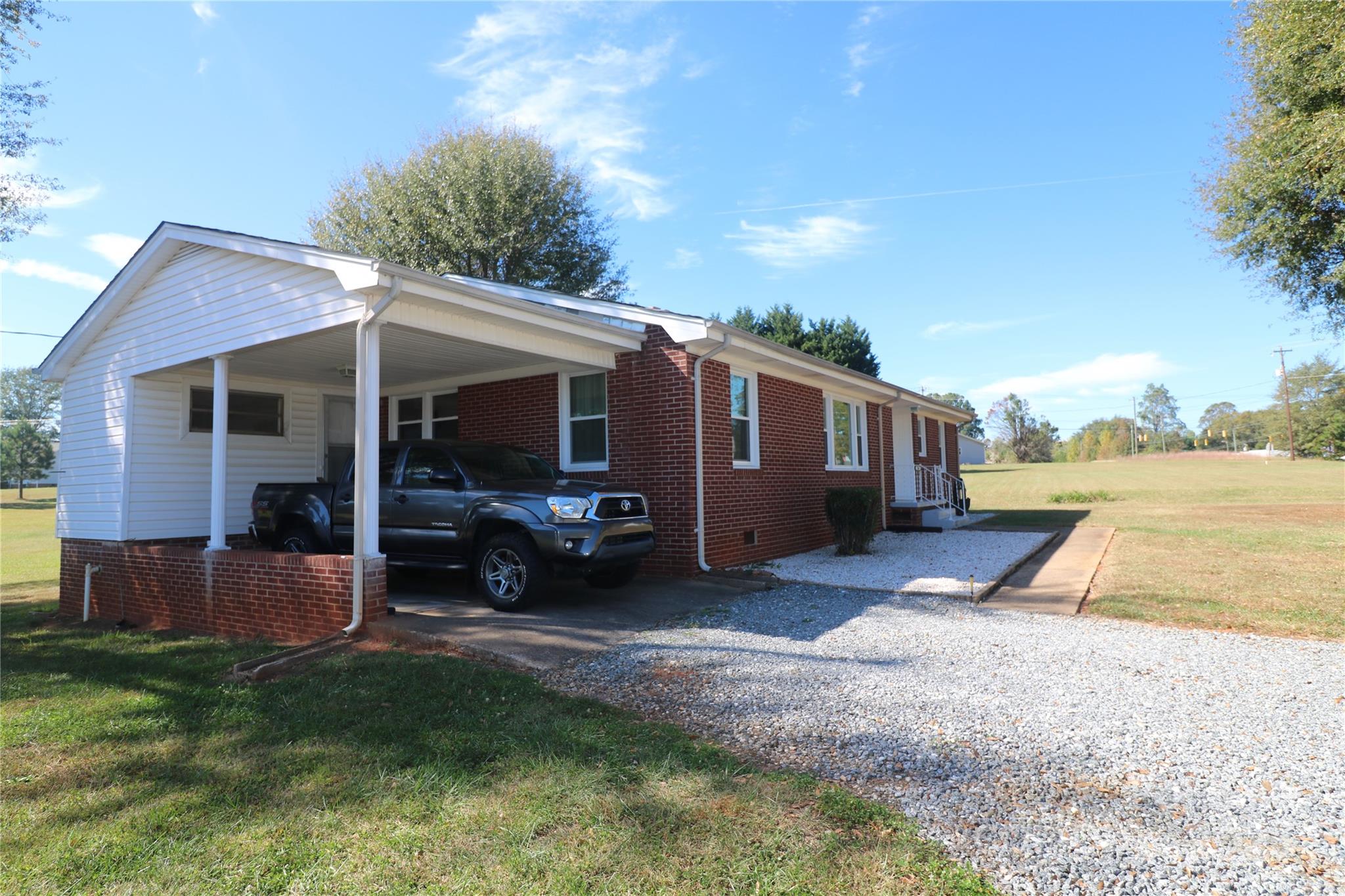 1260 Highway 221 Rutherfordton, NC 28139 - Photo 11 of 30 a view of a house with backyard porch and sitting area