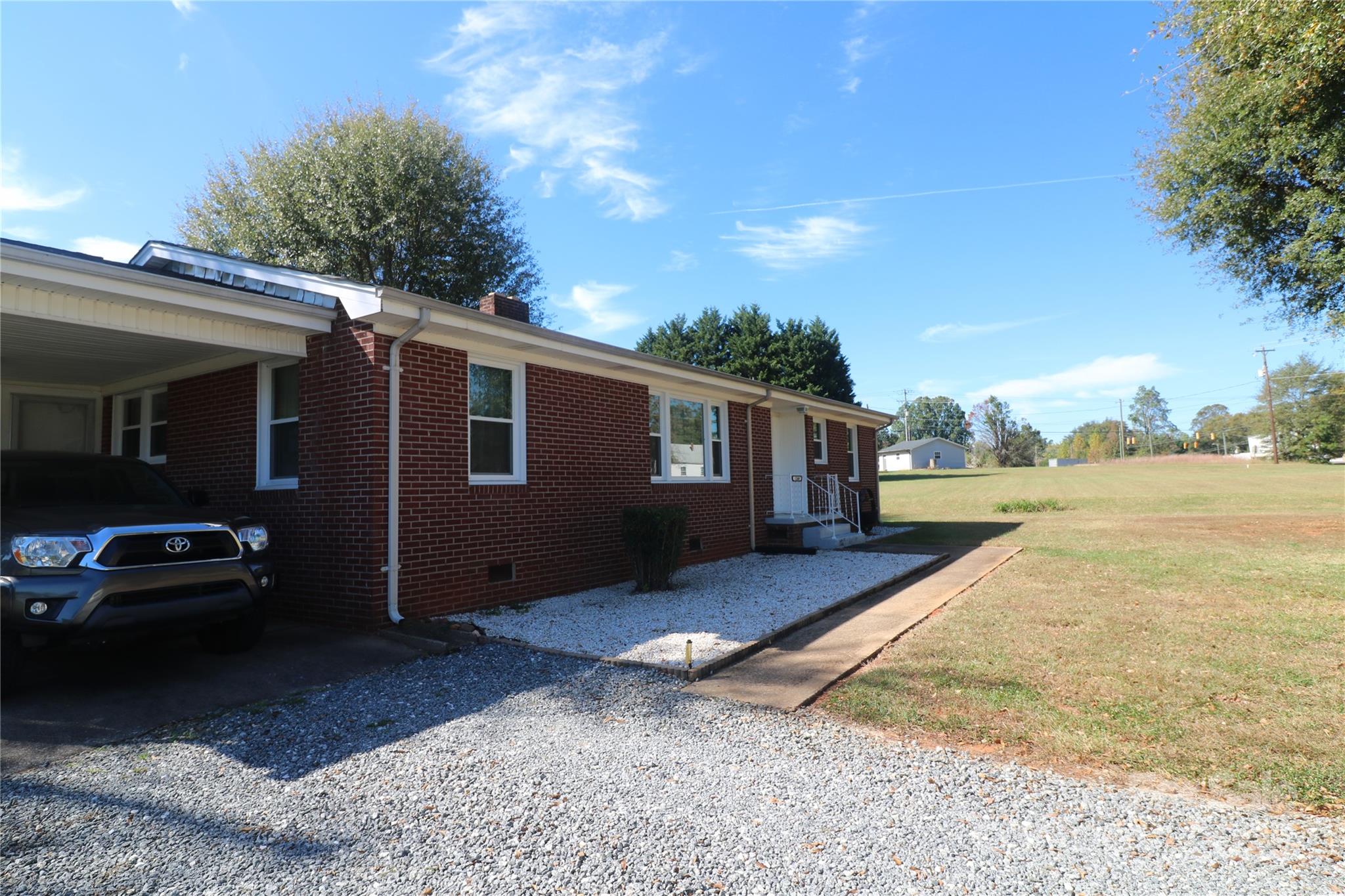 1260 Highway 221 Rutherfordton, NC 28139 - Photo 12 of 30 a view of a car park in front of a house