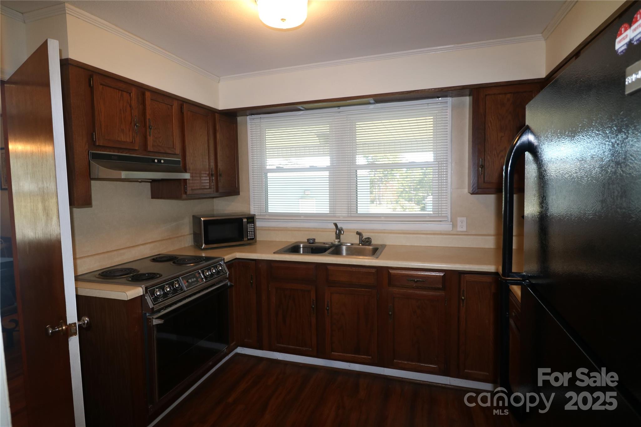 1260 Highway 221 Rutherfordton, NC 28139 - Photo 14 of 30 a kitchen with granite countertop a sink stove and refrigerator