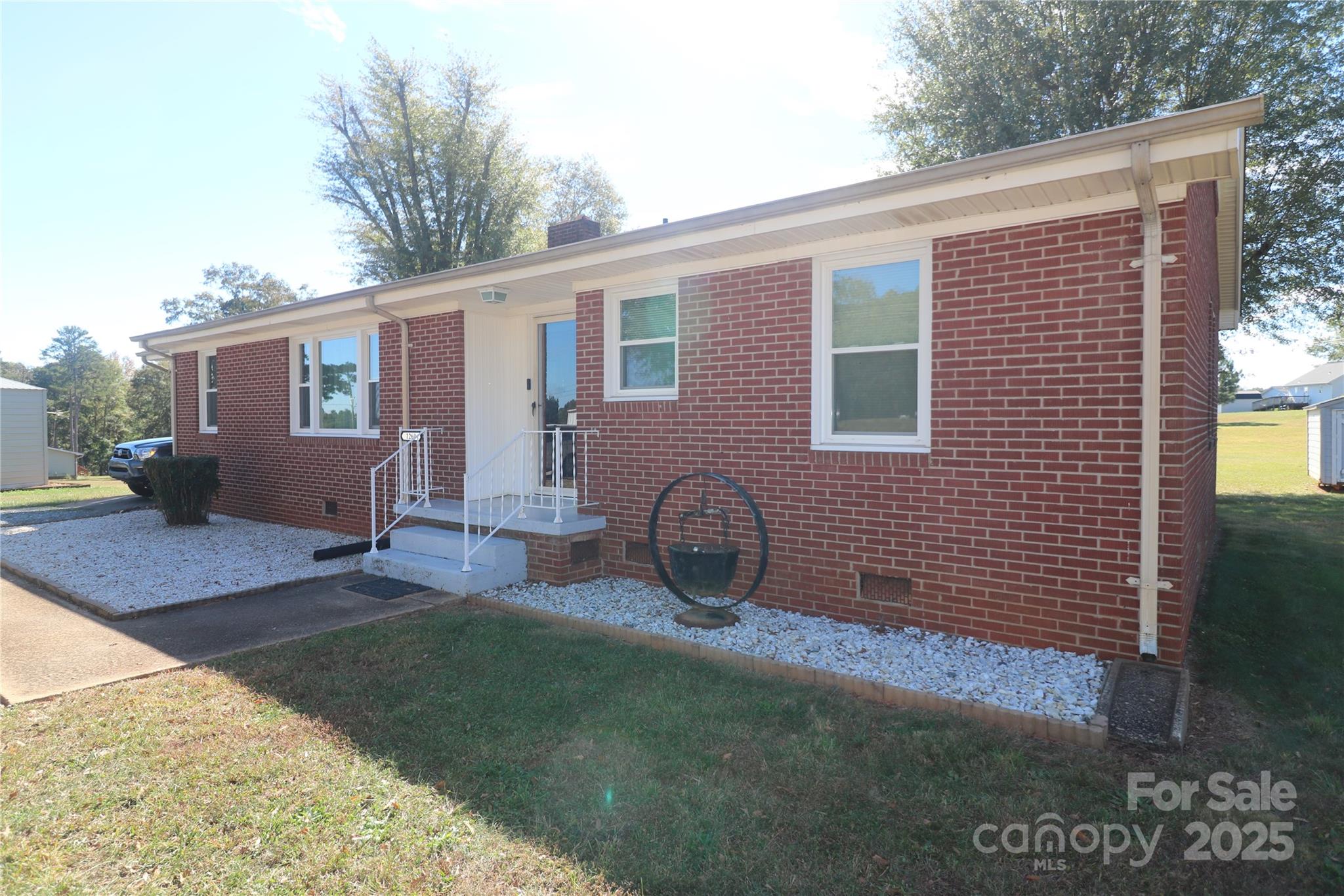 1260 Highway 221 Rutherfordton, NC 28139 - Photo 2 of 30 a front view of a house with patio