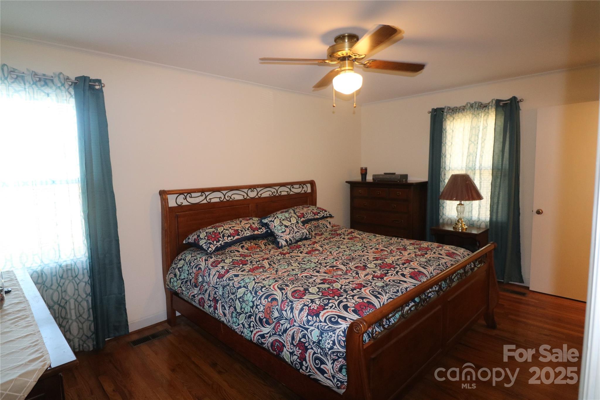 1260 Highway 221 Rutherfordton, NC 28139 - Photo 25 of 30 a bed sitting in a bedroom next to a window