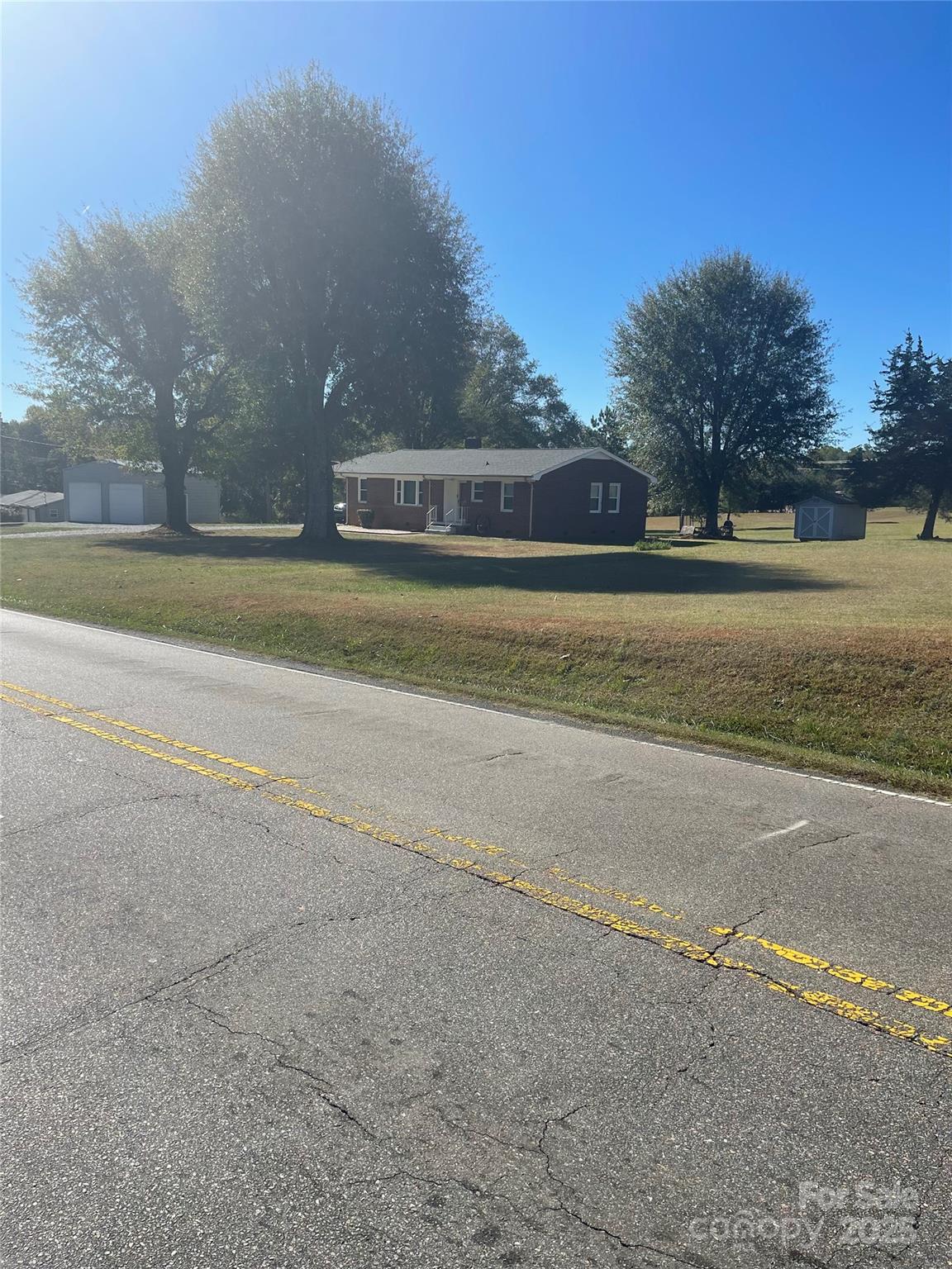 1260 Highway 221 Rutherfordton, NC 28139 - Photo 30 of 30 a view of a house with a yard and a large tree
