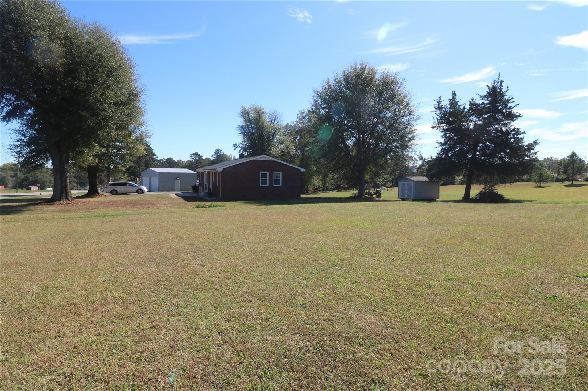 1260 Highway 221 Rutherfordton, NC 28139 - Photo 3 of 30 a view of a field with trees in the background