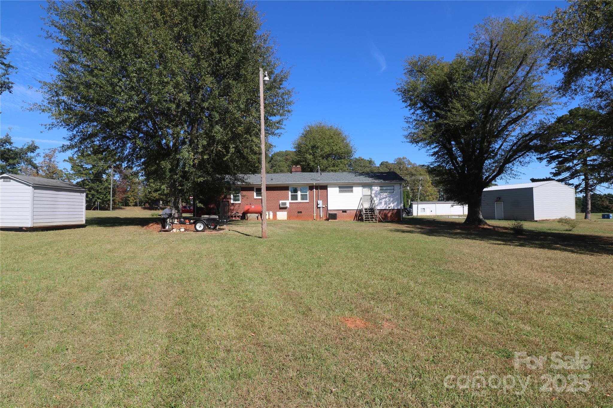1260 Highway 221 Rutherfordton, NC 28139 - Photo 6 of 30 a view of house with outdoor space and tree in the background