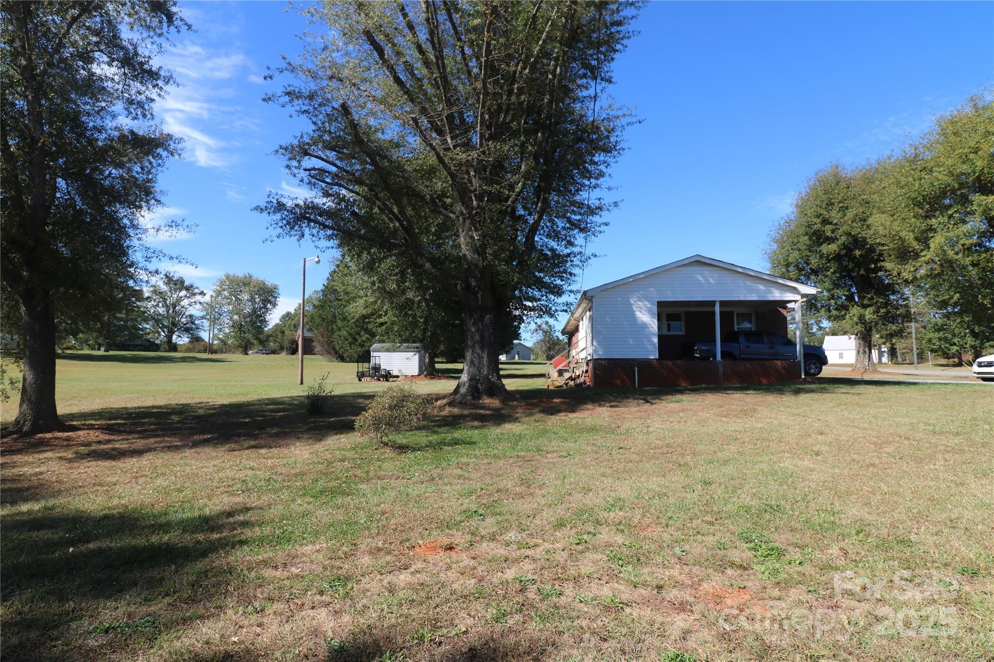 1260 Highway 221 Rutherfordton, NC 28139 - Photo 7 of 30 a view of a house with backyard and tree