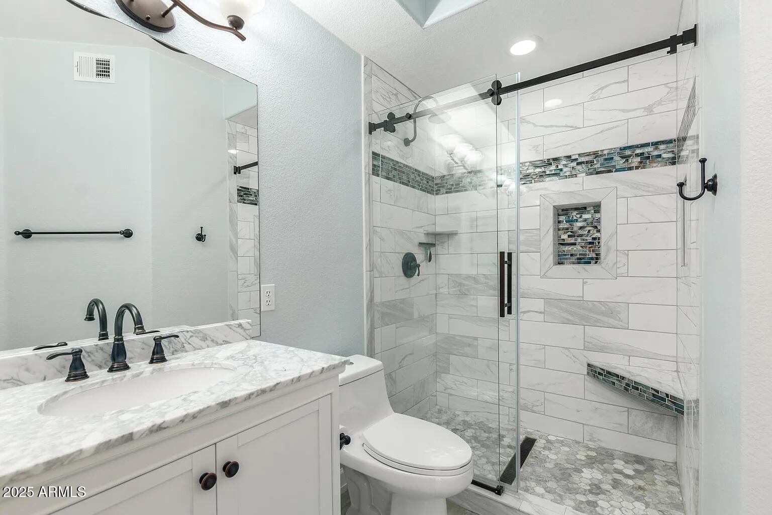 45 East 9th Place, Unit 80 Mesa, AZ 85201 - Photo 12 of 38 a bathroom with a granite countertop sink toilet and shower