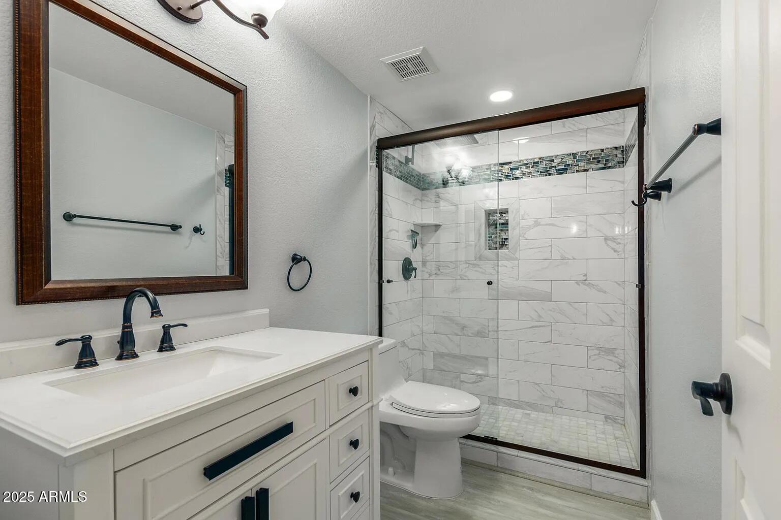 45 East 9th Place, Unit 80 Mesa, AZ 85201 - Photo 16 of 38 a bathroom with a sink a toilet and shower