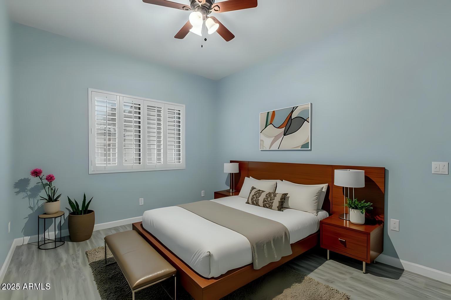 45 East 9th Place, Unit 80 Mesa, AZ 85201 - Photo 17 of 38 a bedroom with a bed and a chandelier