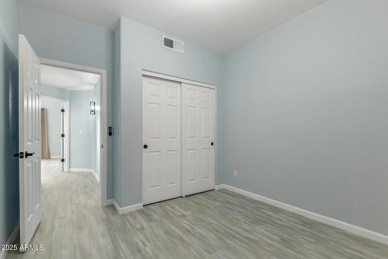 45 East 9th Place, Unit 80 Mesa, AZ 85201 - Photo 20 of 38 a view of a hallway with wooden floor