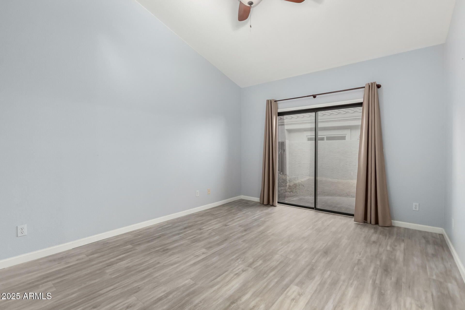 45 East 9th Place, Unit 80 Mesa, AZ 85201 - Photo 25 of 38 a view of an empty room with wooden floor and a window