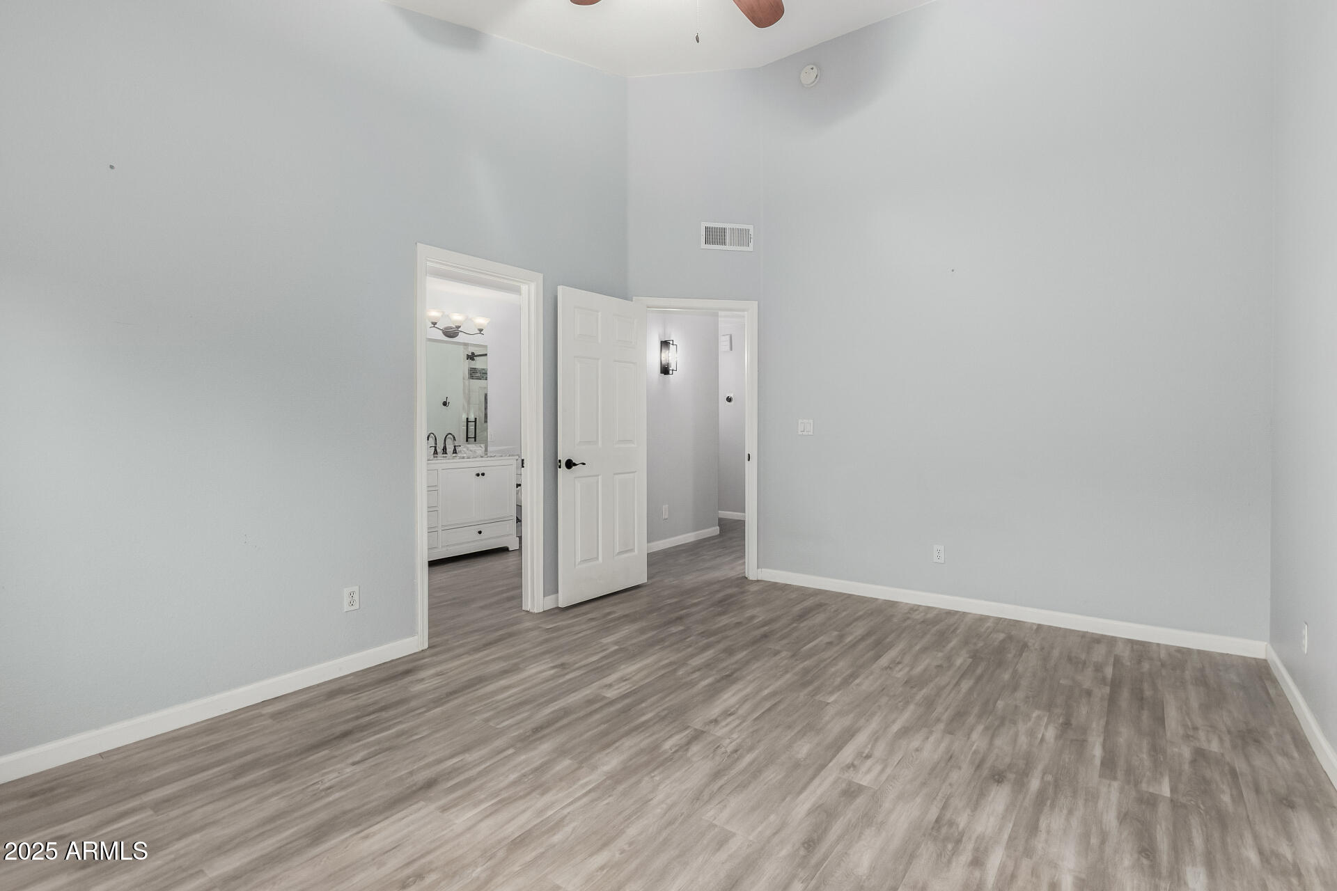 45 East 9th Place, Unit 80 Mesa, AZ 85201 - Photo 26 of 38 a view of an empty room with wooden floor