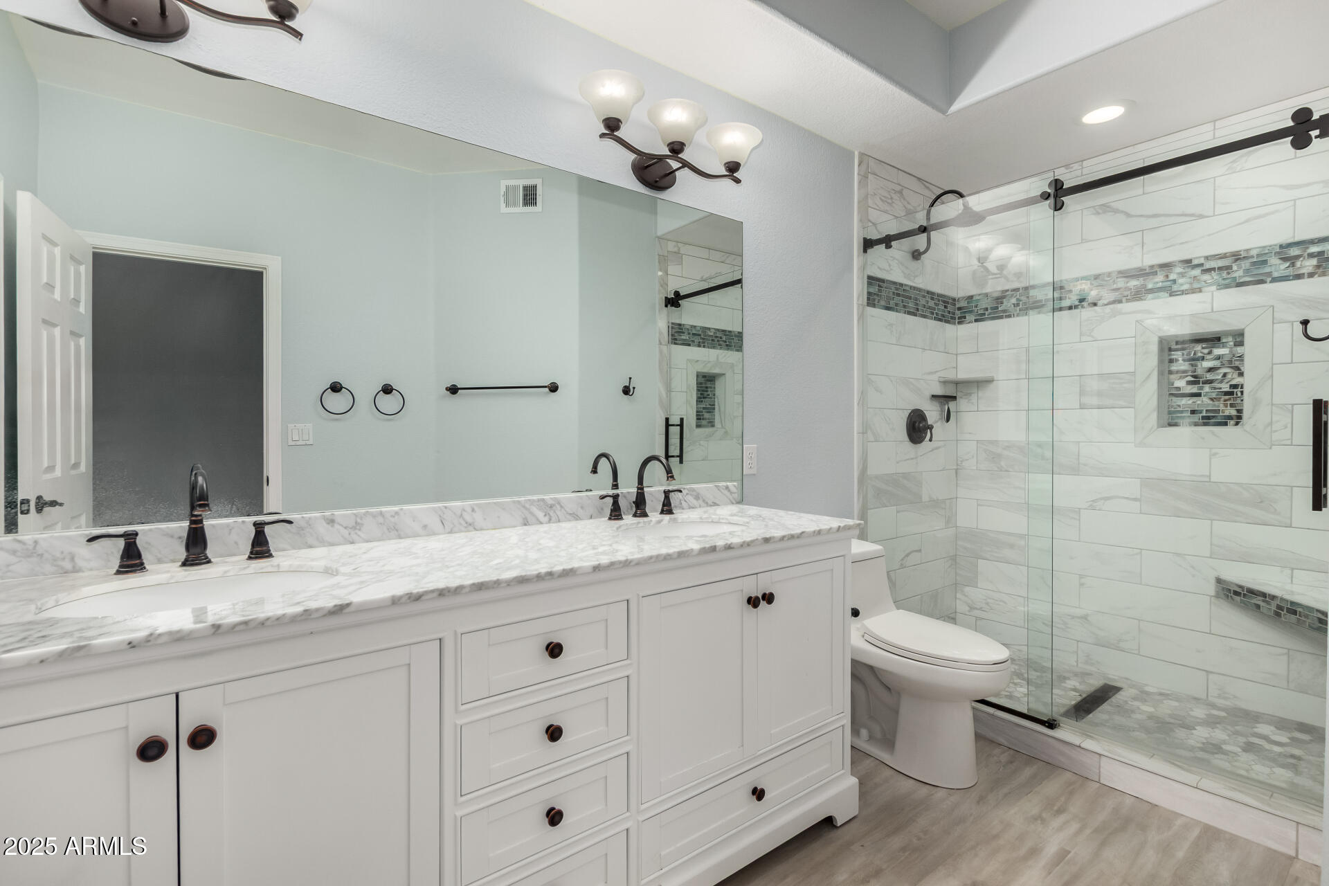 45 East 9th Place, Unit 80 Mesa, AZ 85201 - Photo 27 of 38 a bathroom with a granite countertop sink a toilet and shower