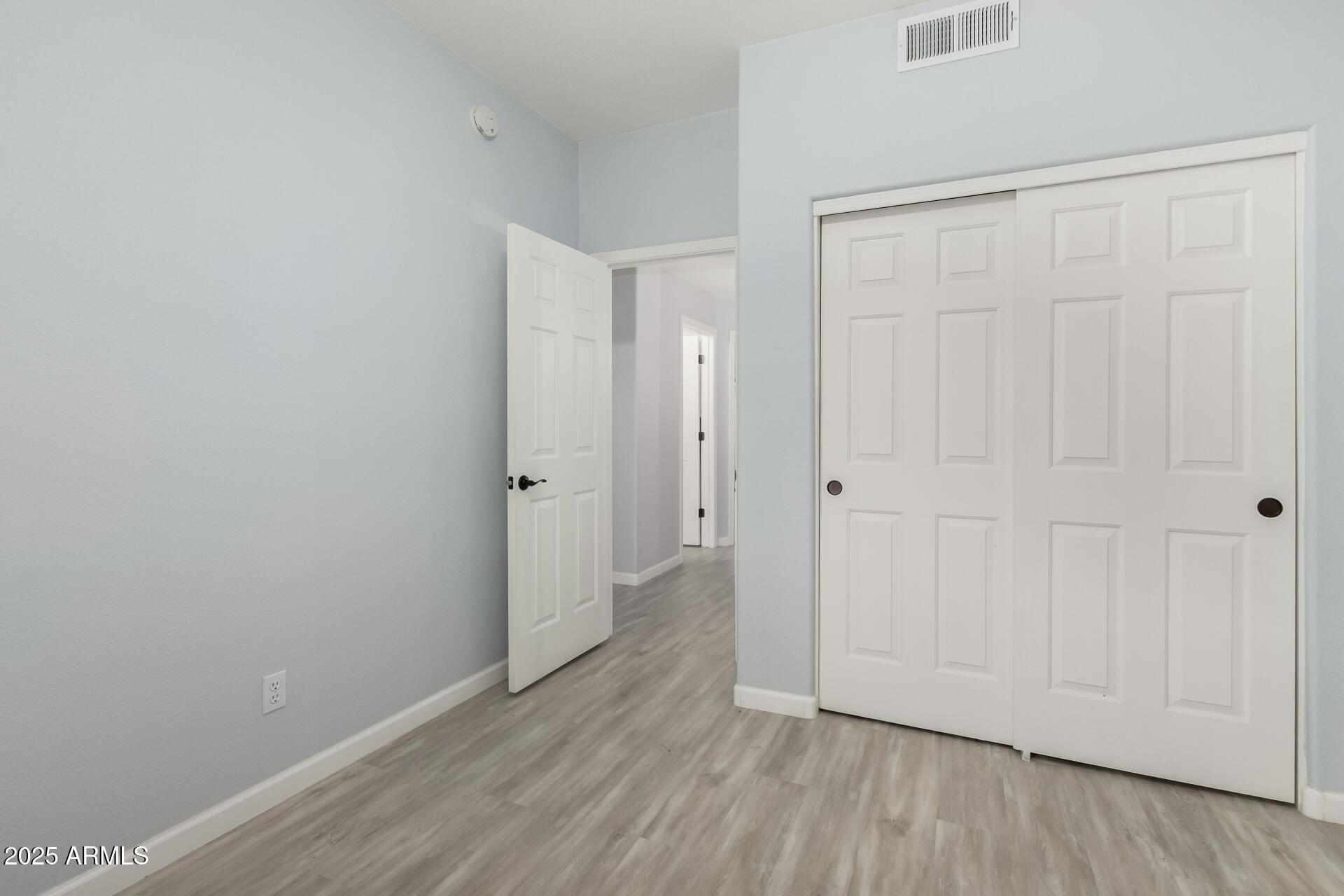 45 East 9th Place, Unit 80 Mesa, AZ 85201 - Photo 29 of 38 a view of an empty room with wooden floor