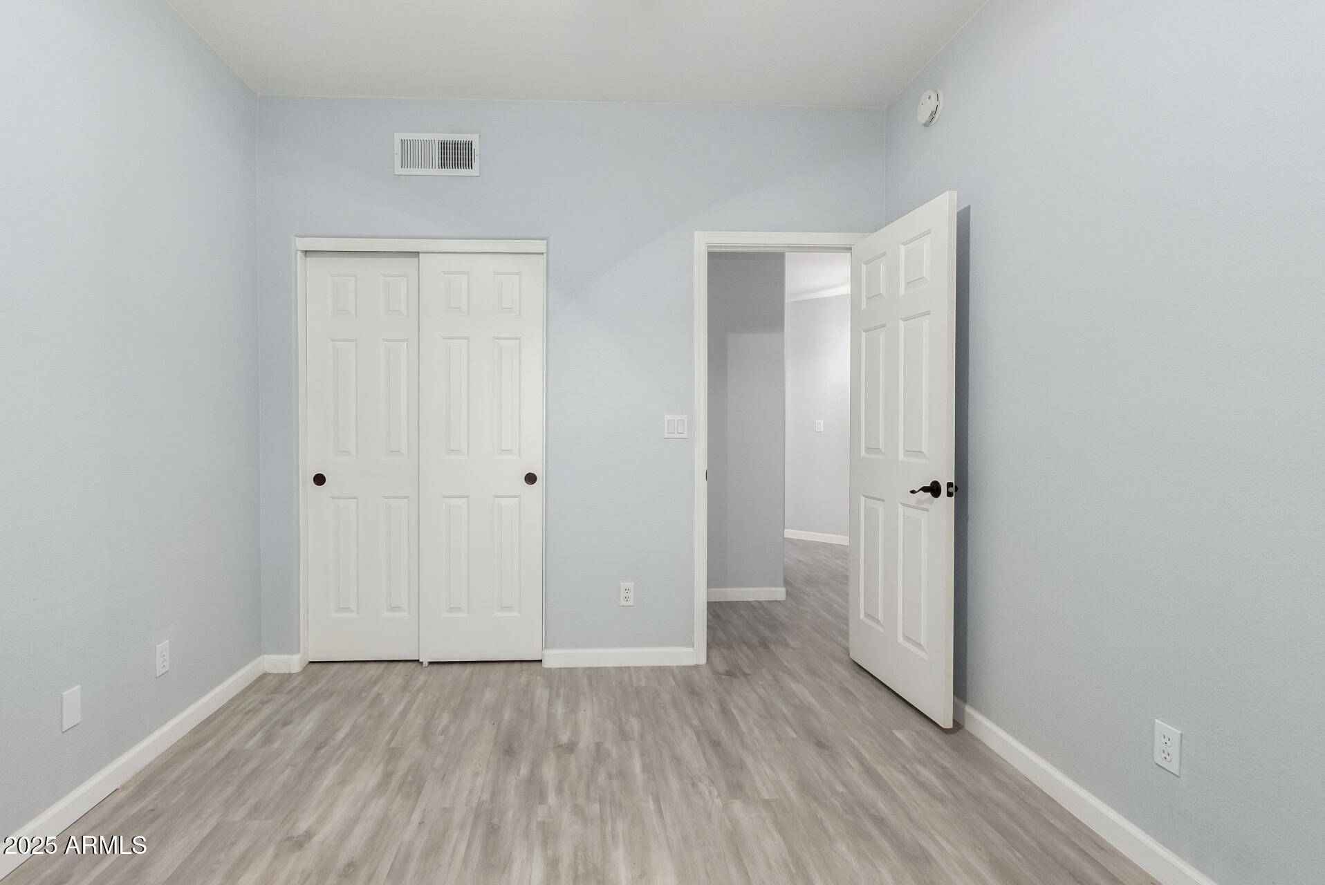45 East 9th Place, Unit 80 Mesa, AZ 85201 - Photo 31 of 38 a view of an empty room with wooden floor