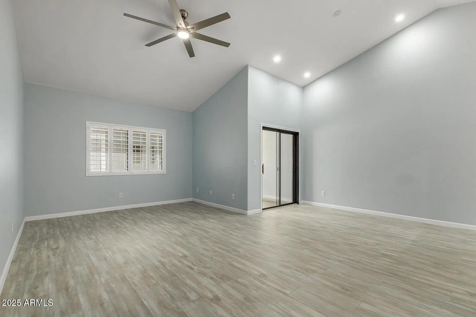 45 East 9th Place, Unit 80 Mesa, AZ 85201 - Photo 8 of 38 wooden floor in an empty room with a window