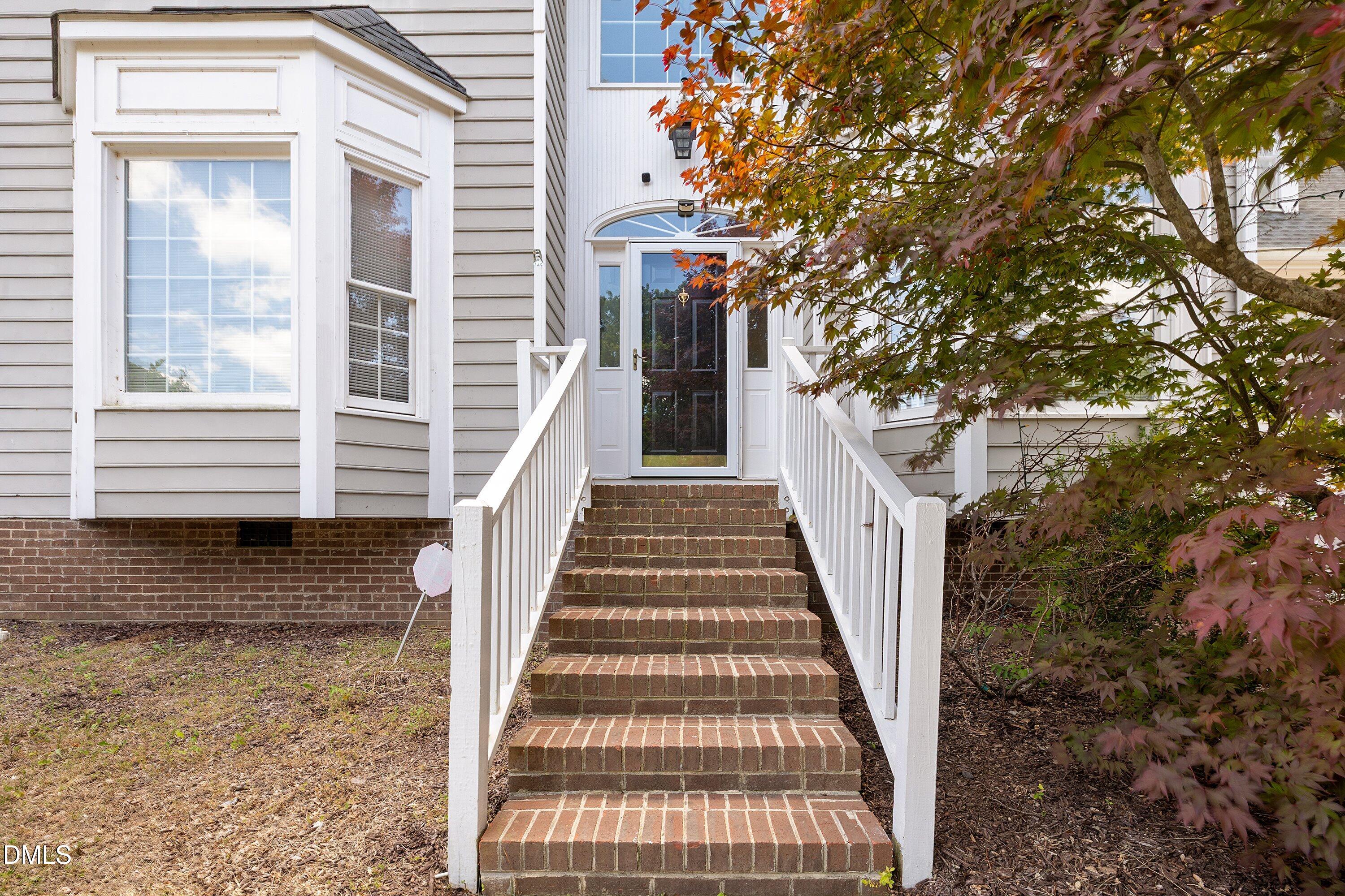 2517 Birchford Court Raleigh, NC 27604 - Photo 5 of 63 a view of a pathway of a house with large windows