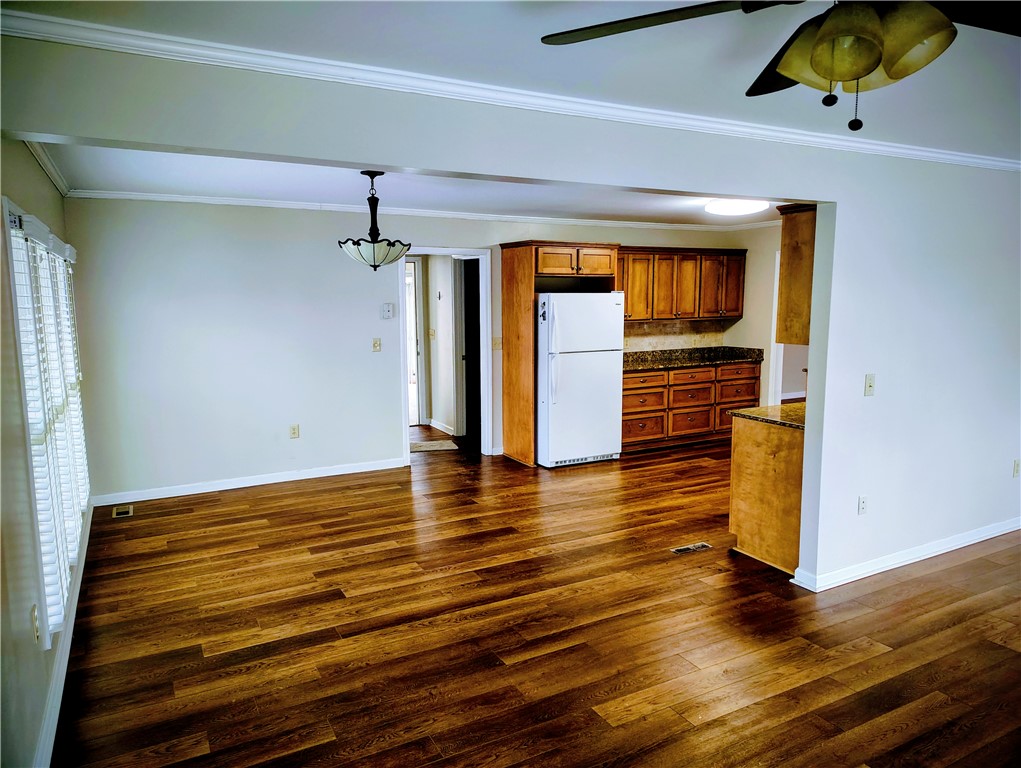 1809 Busby Road Anderson, SC 29626 - Photo 26 of 43 This inviting space features rich flooring, an open layout, and a functional kitchen.