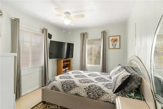 a view of a bedroom with a window and cabinet