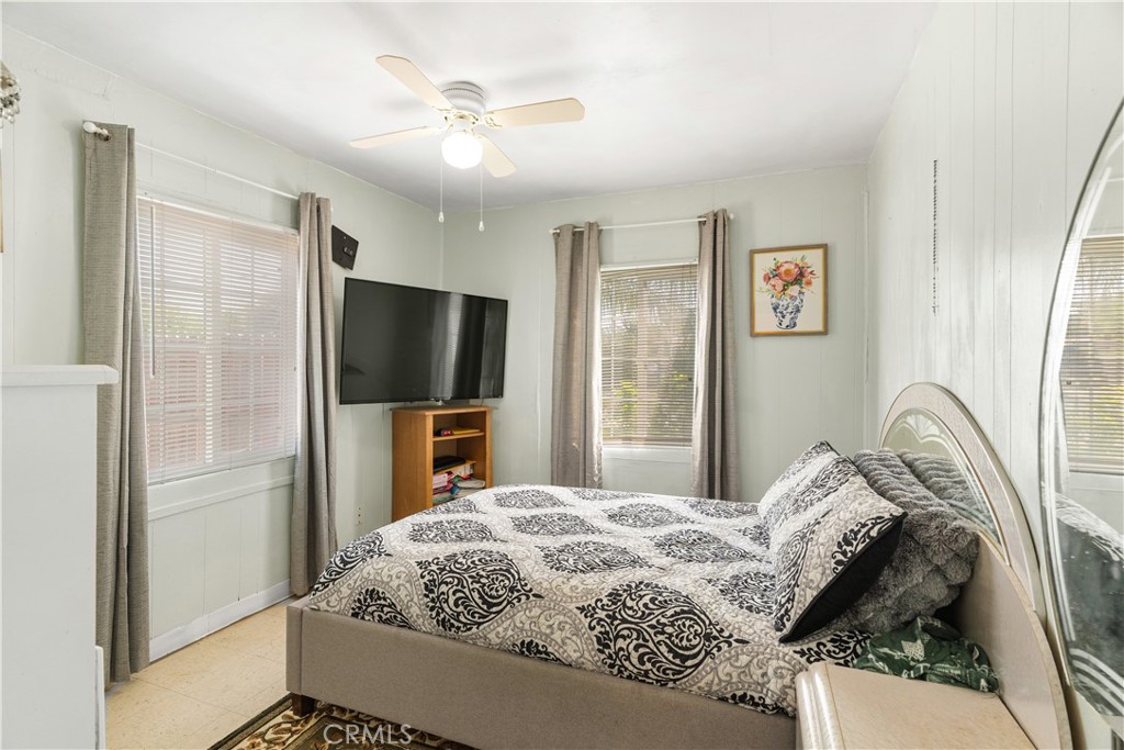 2113 Princeton Street Delano, CA 93215 - Photo 16 of 32 a bedroom with a bed and a flat screen tv