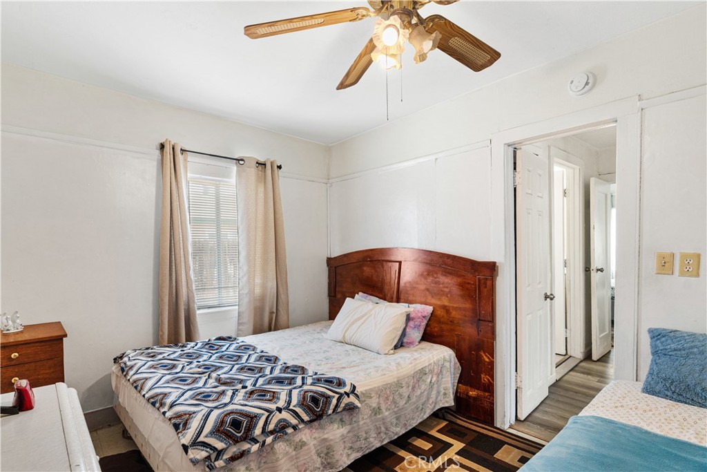 2113 Princeton Street Delano, CA 93215 - Photo 18 of 32 a bedroom with a bed and wooden floor