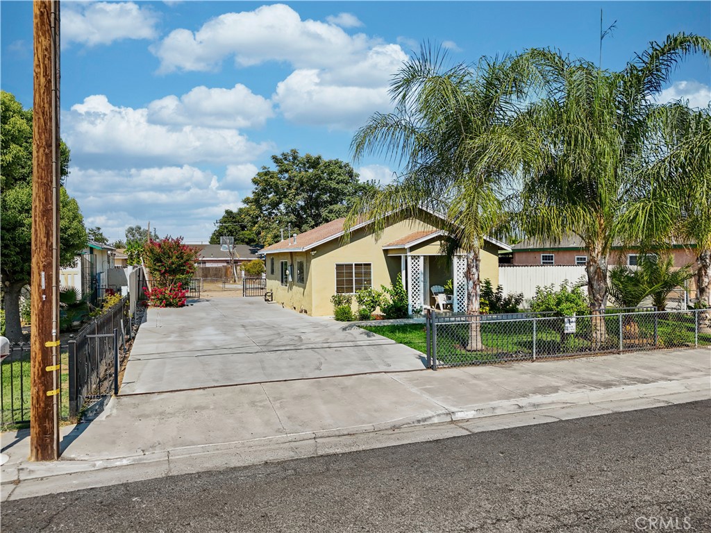 2113 Princeton Street Delano, CA 93215 - Photo 2 of 32 a front view of house with yard and green space