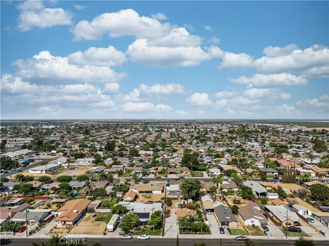an aerial view of multiple houses with outdoor space
