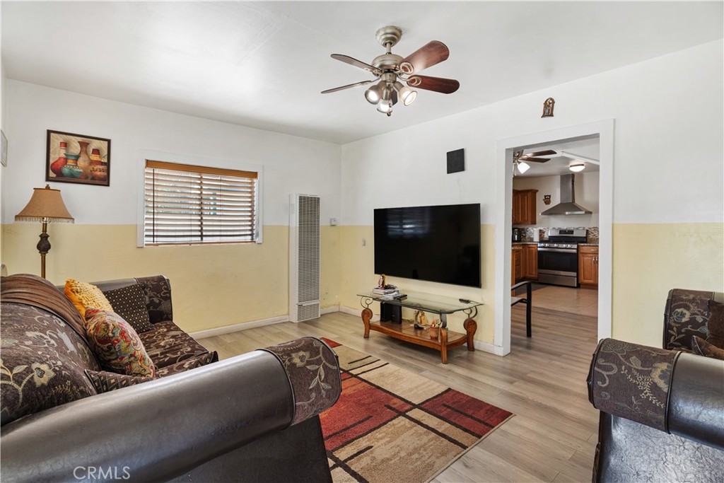 2113 Princeton Street Delano, CA 93215 - Photo 4 of 32 a living room with furniture and a flat screen tv