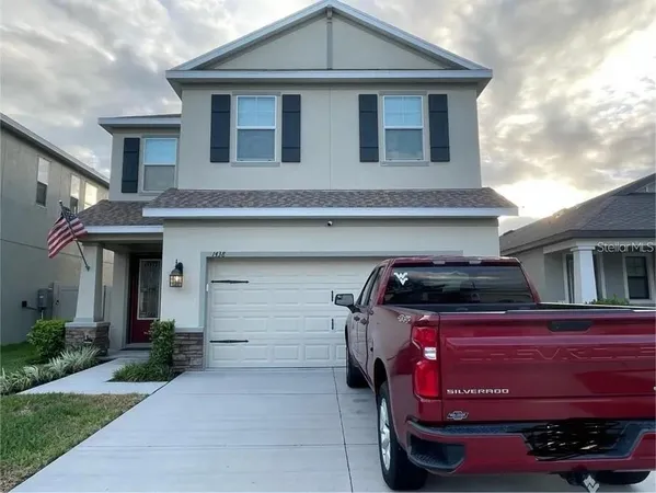 a front view of a house with a garage