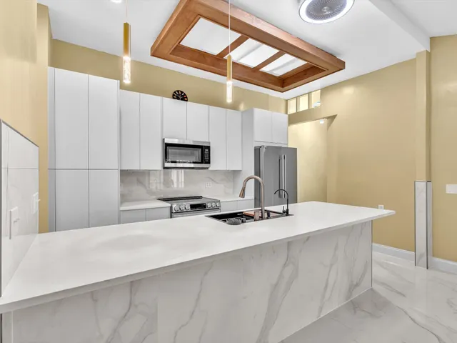 a view of a kitchen with a sink