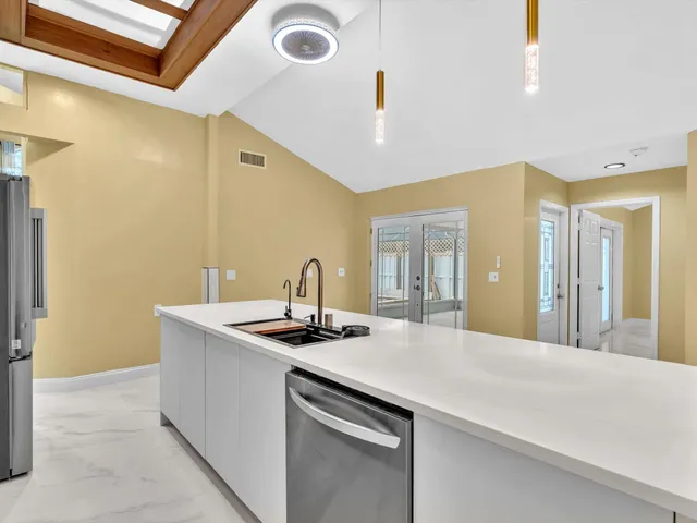 a kitchen with a stove microwave and sink